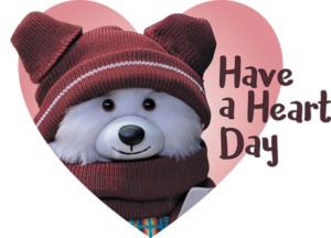 A heart shape with a polar bear stuffie wearing a funky toque and scarf, with the words "Have a Heart Day".