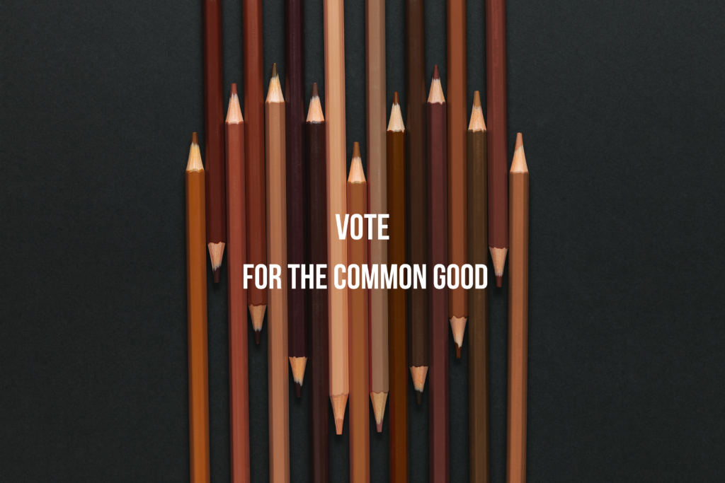 A heart shape made up of carefully arranged pencils in diverse shades of brown and black. Vote for the Common Good forms a header in contrasting white.
